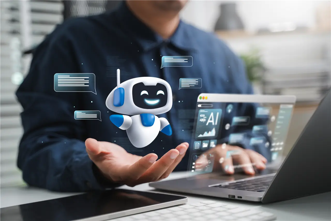 Die Grafik zeigt eine Person an einem Laptop, die mit einem l&auml;chelnden blauen und wei&szlig;en Roboter interagiert. Der Roboter schwebt und scheint Texte zu verarbeiten, w&auml;hrend der Bildschirm des Laptops Informationen zu KI anzeigt.